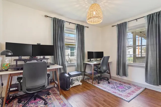 a workspace with furniture and a window