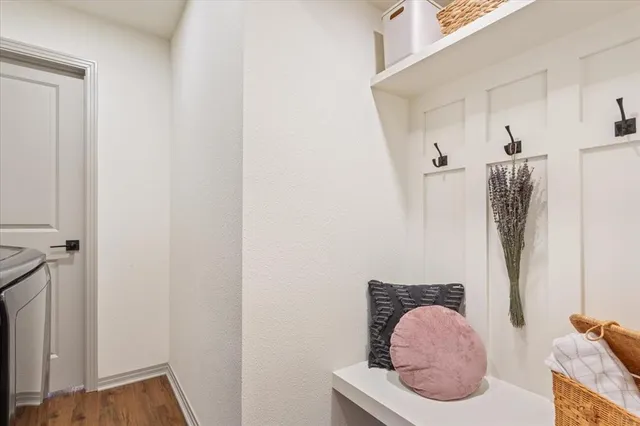 a room with furniture and a potted plant