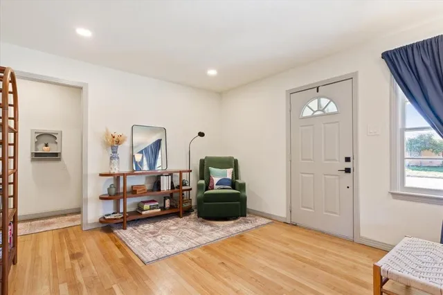 a bedroom with furniture and window