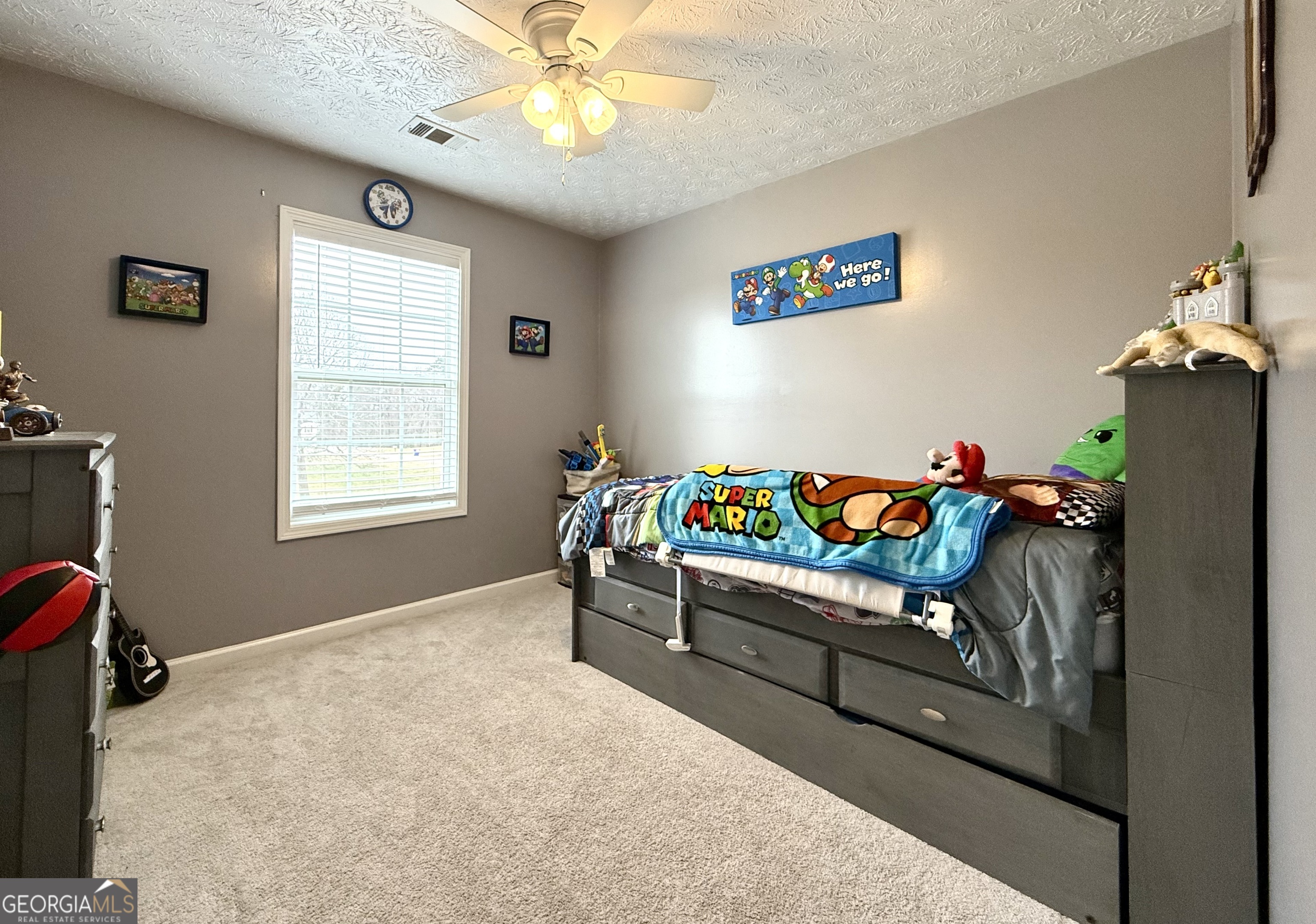 110 Waterloo Drive Mount Airy, GA 30563 - Photo 12 of 24 a bedroom with furniture and a window