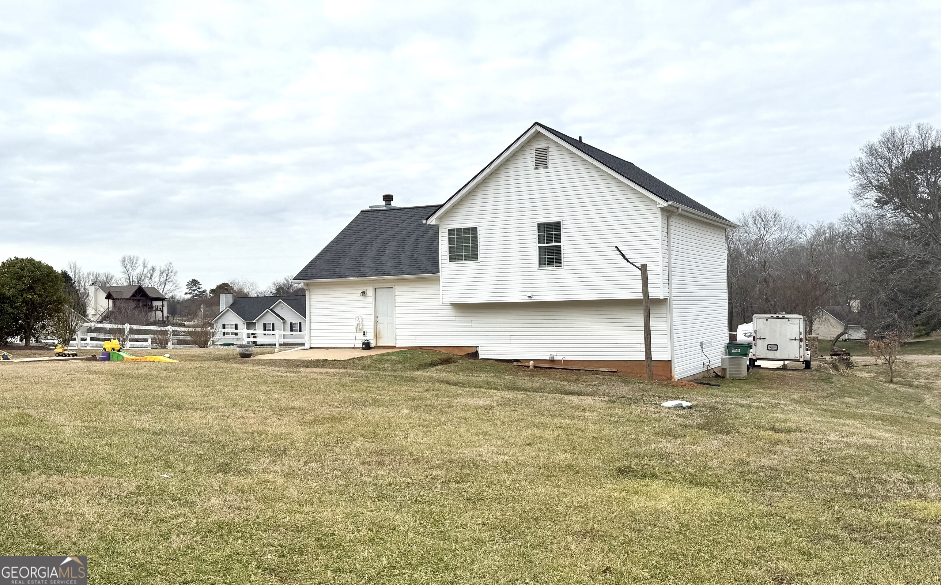 110 Waterloo Drive Mount Airy, GA 30563 - Photo 19 of 24 a view of a house with a yard and sitting area