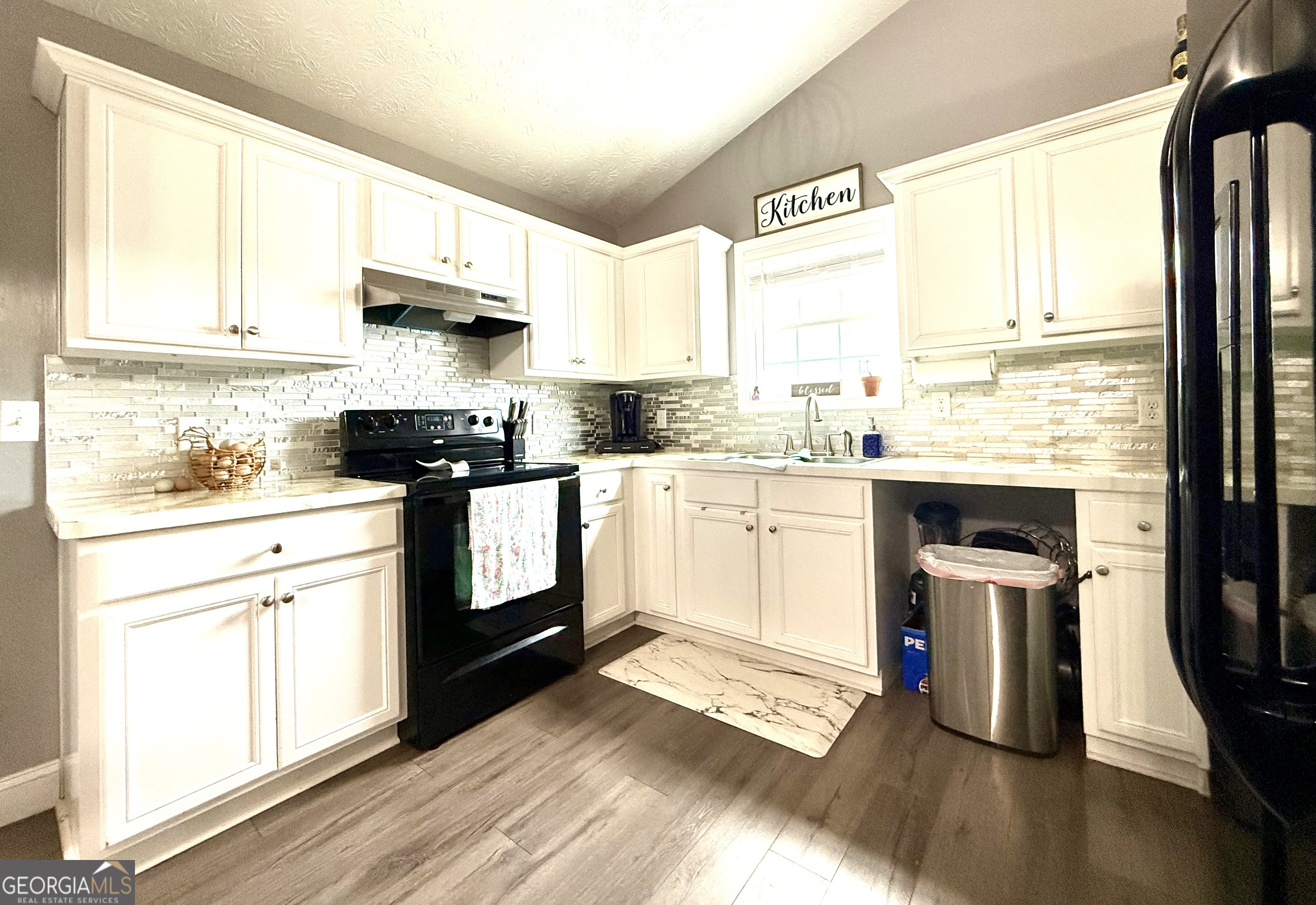 110 Waterloo Drive Mount Airy, GA 30563 - Photo 7 of 24 a kitchen with stainless steel appliances granite countertop a stove a sink dishwasher and a refrigerator