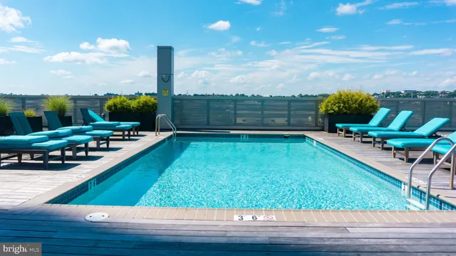 a view of a swimming pool with chairs