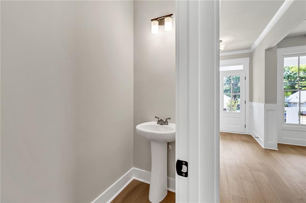 231 East Marable Street Monroe, GA 30655 - Photo 20 of 36 a bathroom with a sink mirror and toilet