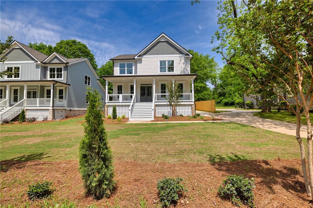 231 East Marable Street Monroe, GA 30655 - Photo 2 of 36 a front view of a house with garden