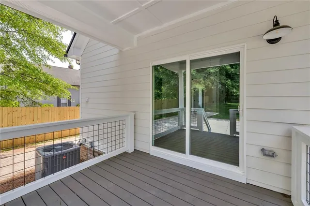a view of balcony with wooden floor