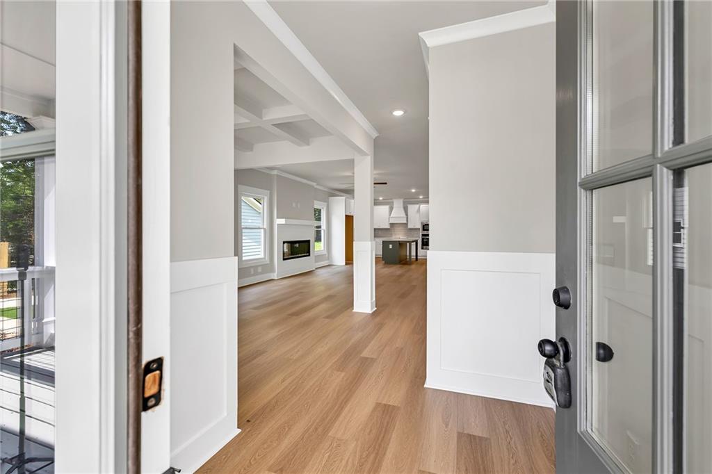 231 East Marable Street Monroe, GA 30655 - Photo 3 of 36 a view of a hallway with wooden floor
