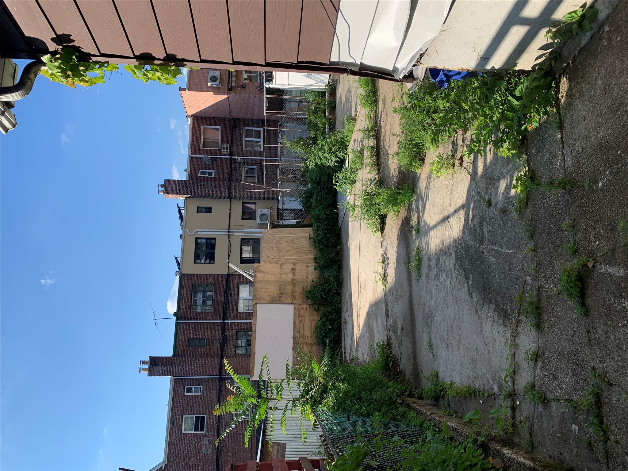 152-05 79th Avenue Queens, NY 11367 - Photo 3 of 8 View of yard featuring a residential view