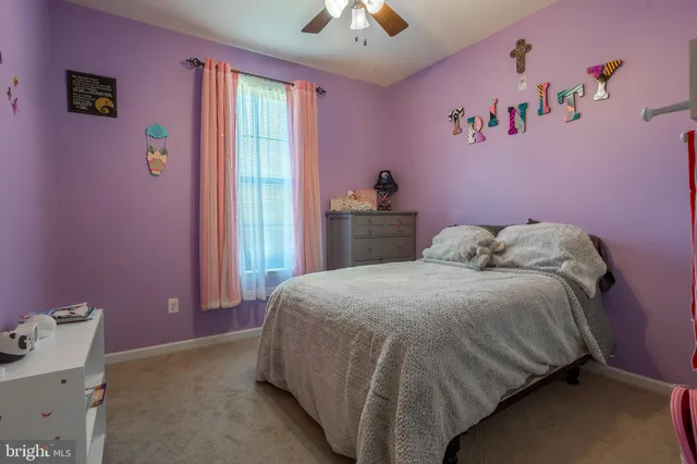 a bedroom with a bed and a table