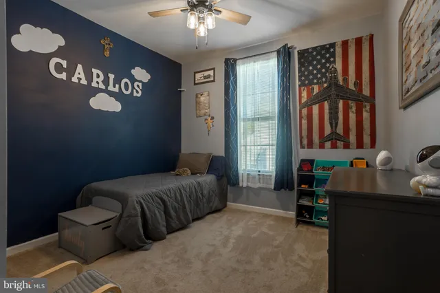 a bedroom with a bed and chair