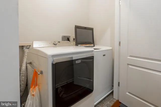 a bedroom with a large bed and a large window