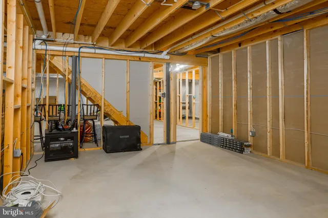 a balcony with furniture and a potted plant