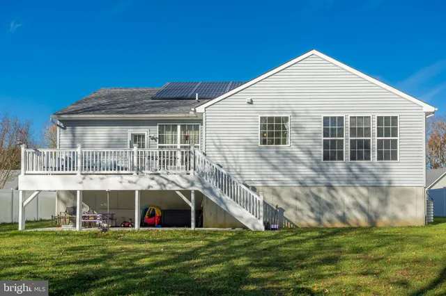 a backyard of a house with lots of green space and plants