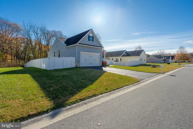 a view of a house with swimming pool and yard