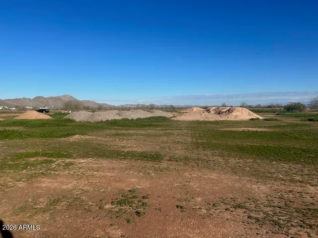 a view of an ocean beach and city