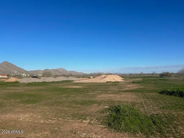 a view of an ocean and a mountain