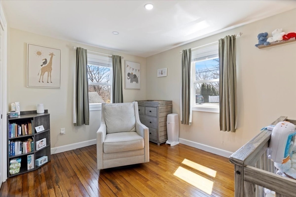 19 Warren Avenue Saugus, MA 01906 - Photo 13 of 33 a living room with furniture and a book shelf