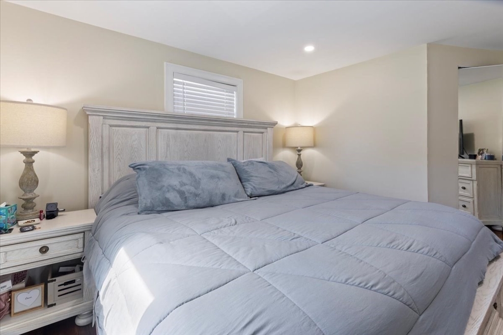 19 Warren Avenue Saugus, MA 01906 - Photo 17 of 33 a bedroom with a bed and a night stand