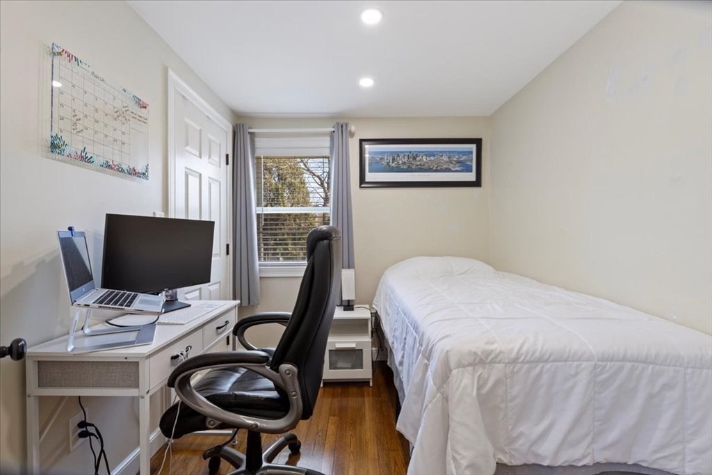 19 Warren Avenue Saugus, MA 01906 - Photo 19 of 33 a bedroom with bed and a workspace