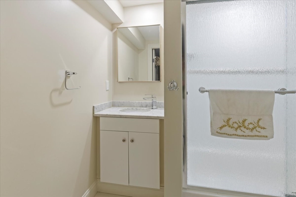 19 Warren Avenue Saugus, MA 01906 - Photo 24 of 33 a bathroom with a sink and a mirror