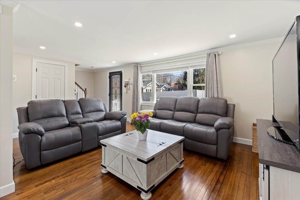 19 Warren Avenue Saugus, MA 01906 - Photo 8 of 33 a living room with furniture and a flat screen tv