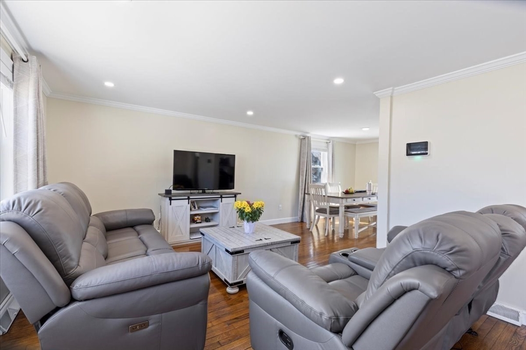 19 Warren Avenue Saugus, MA 01906 - Photo 10 of 33 a living room with furniture and a flat screen tv