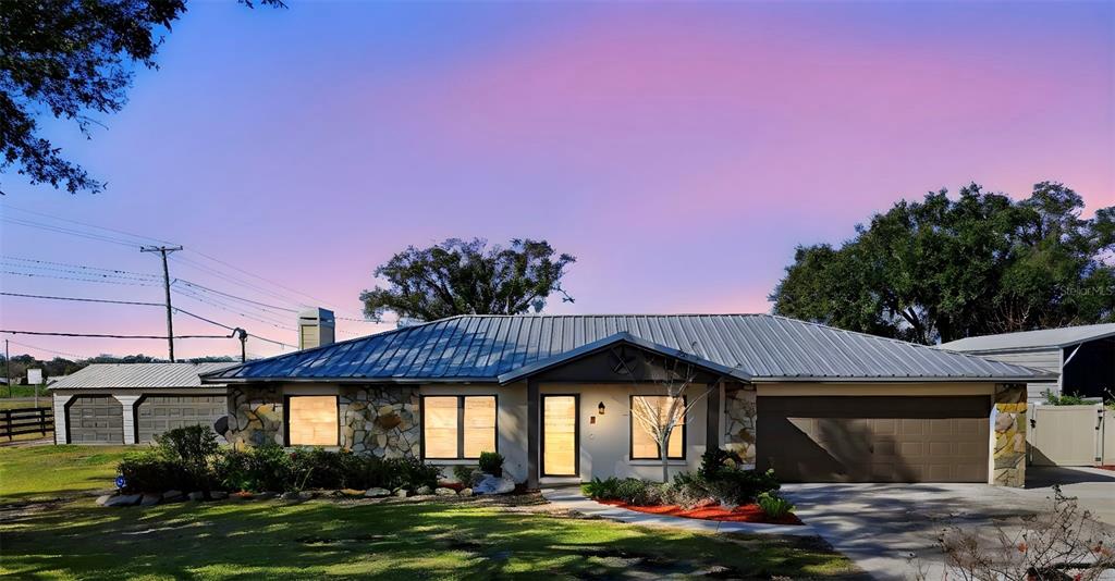 5309 South Farkas Road Plant City, FL 33567 - Photo 1 of 43 a front view of a house with a garden