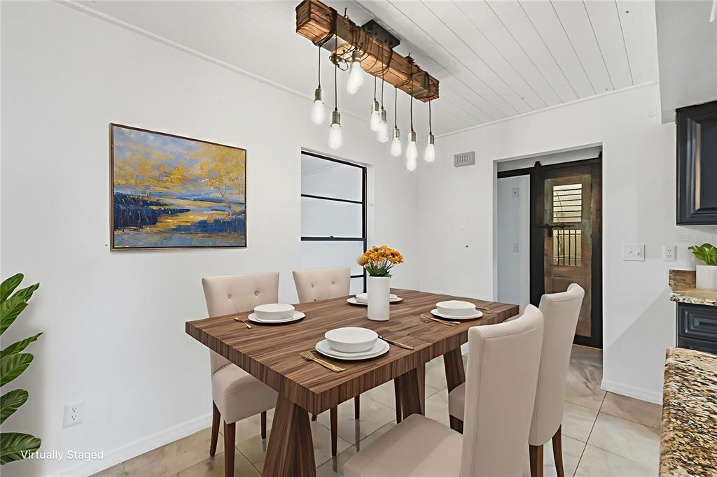 5309 South Farkas Road Plant City, FL 33567 - Photo 11 of 43 a view of a dining room with furniture and chandelier