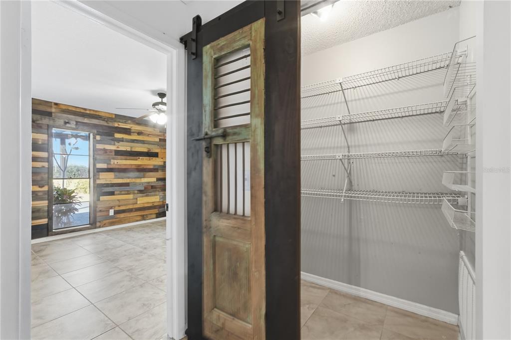 5309 South Farkas Road Plant City, FL 33567 - Photo 22 of 43 a view of walk in closet with empty racks