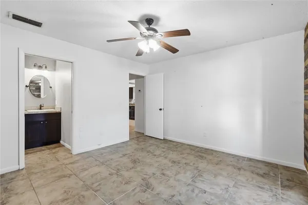 a view of an empty room with a bathroom