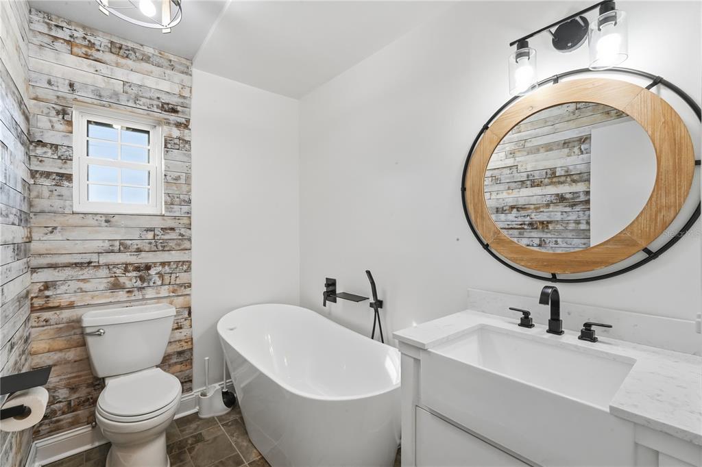 5309 South Farkas Road Plant City, FL 33567 - Photo 31 of 43 a bathroom with a toilet a sink and a mirror