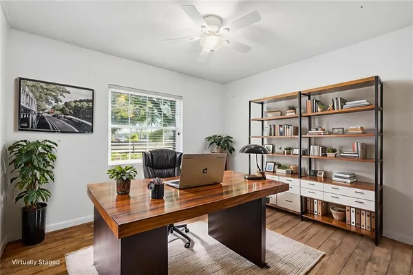 a workspace with furniture and window