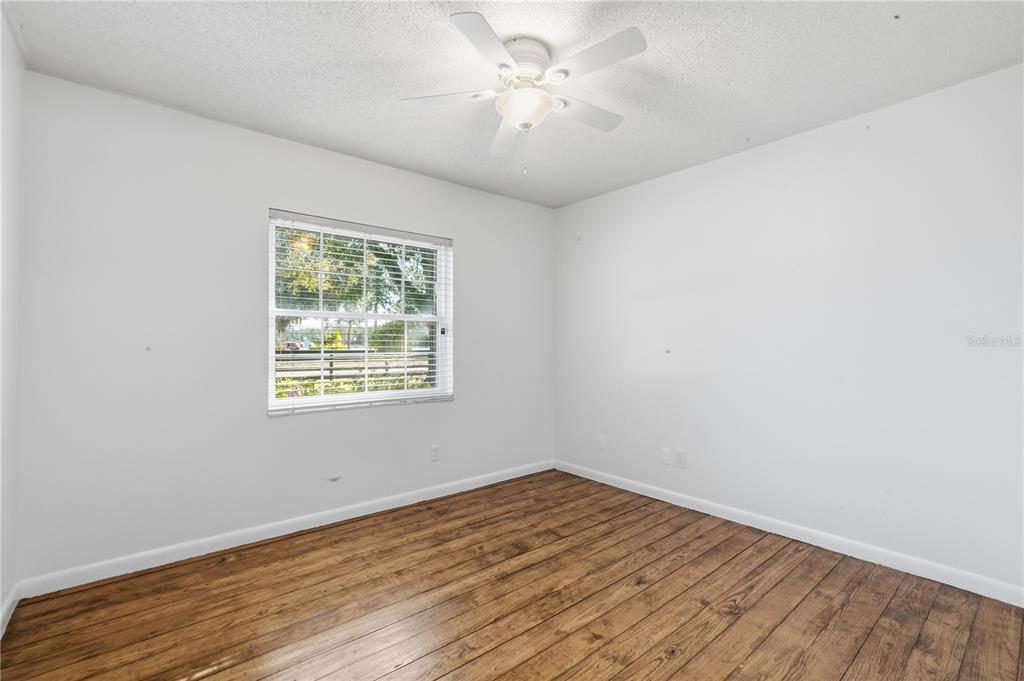 5309 South Farkas Road Plant City, FL 33567 - Photo 33 of 43 a view of empty room with wooden floor and fan
