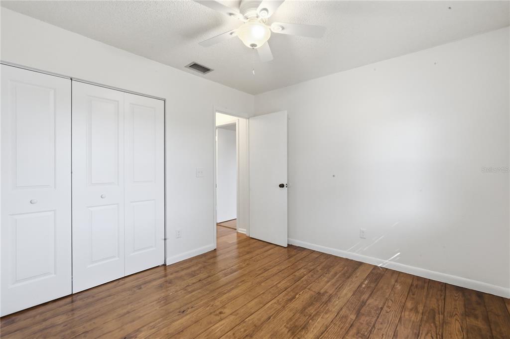 5309 South Farkas Road Plant City, FL 33567 - Photo 34 of 43 a view of an empty room with wooden floor