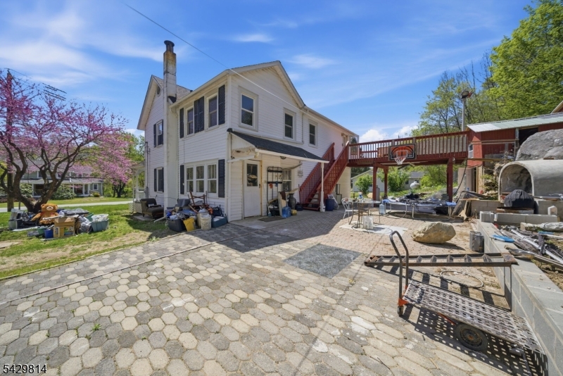 251 Russia Road Oak Ridge, NJ 07438 - Photo 29 of 34 a view of a house with backyard porch and sitting area