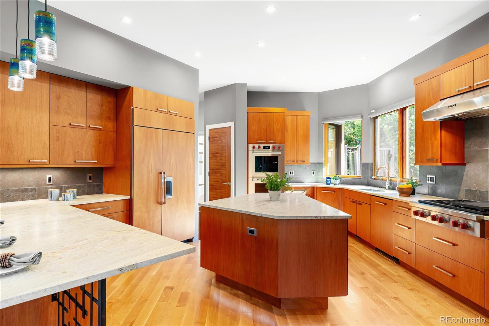 755 Jonquil Place Boulder, CO 80304 - Photo 14 of 40 a large kitchen with stainless steel appliances granite countertop a sink and cabinets