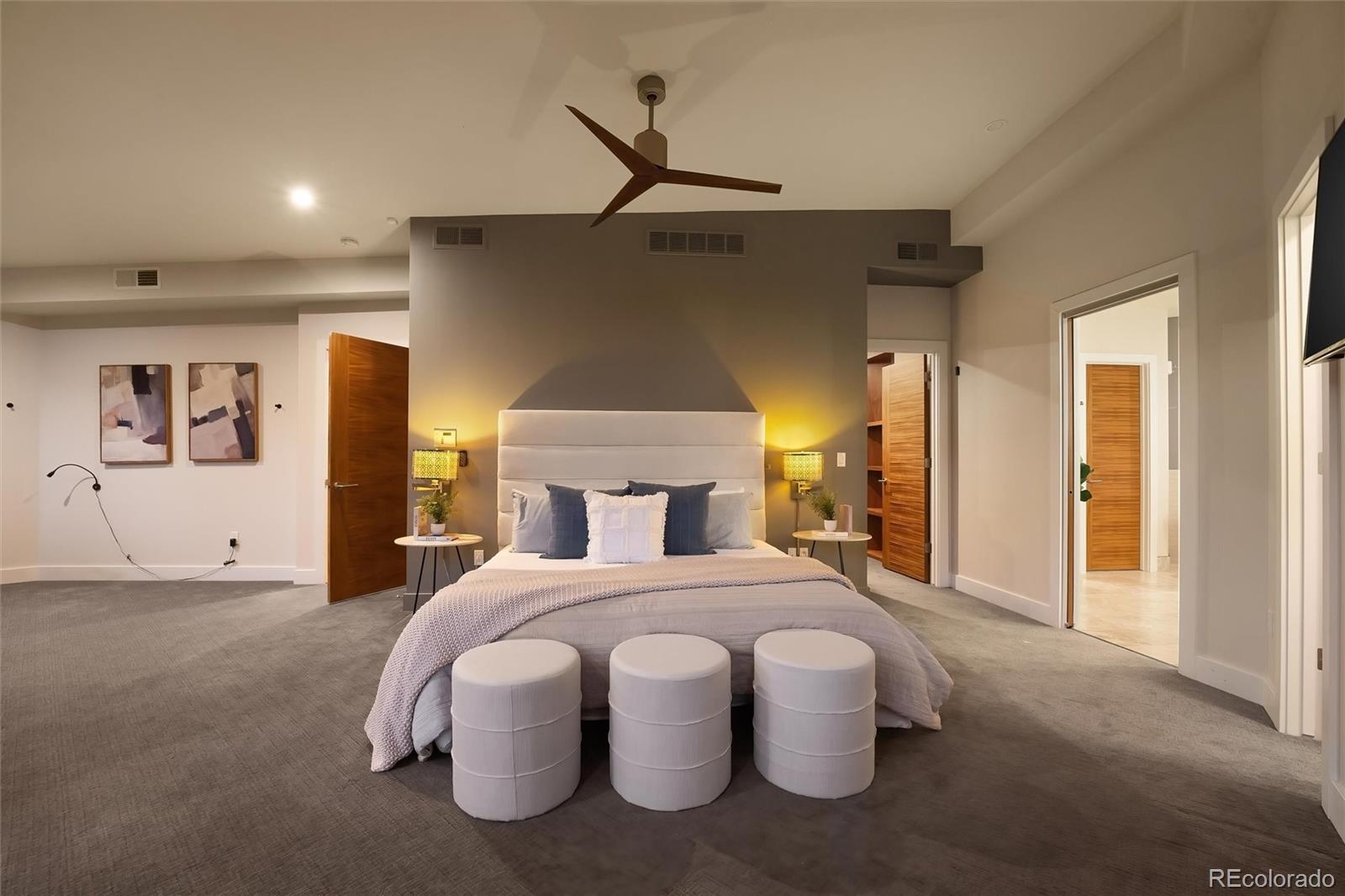 755 Jonquil Place Boulder, CO 80304 - Photo 23 of 40 a bedroom with a bed and a chandelier