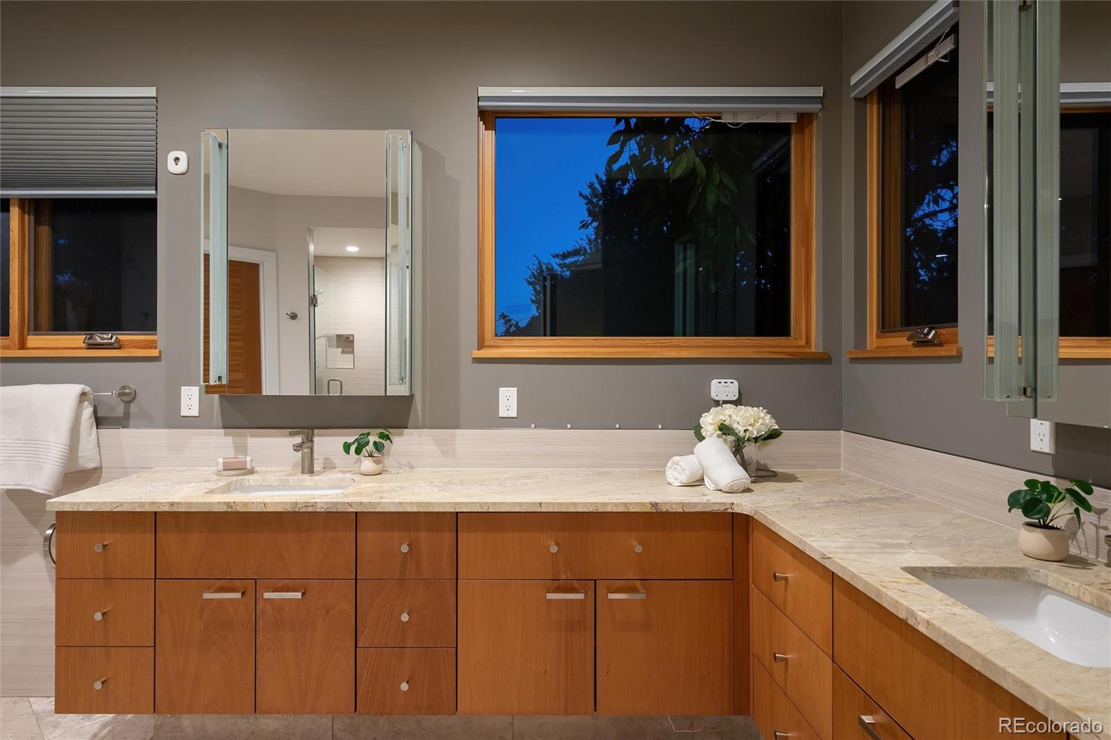 755 Jonquil Place Boulder, CO 80304 - Photo 27 of 40 a bathroom with a sink and a mirror
