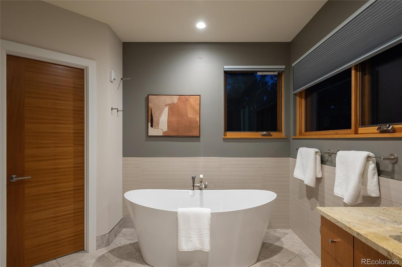 755 Jonquil Place Boulder, CO 80304 - Photo 28 of 40 a bathroom with a bathtub and a sink