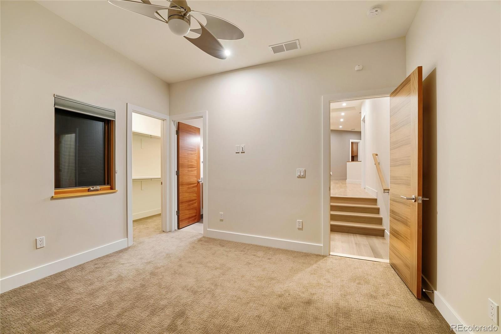 755 Jonquil Place Boulder, CO 80304 - Photo 32 of 40 an empty room with a empty space and chandelier fan