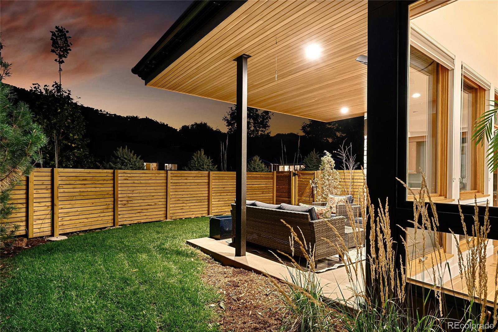 755 Jonquil Place Boulder, CO 80304 - Photo 37 of 40 a view of a patio with a table chairs and wooden fence
