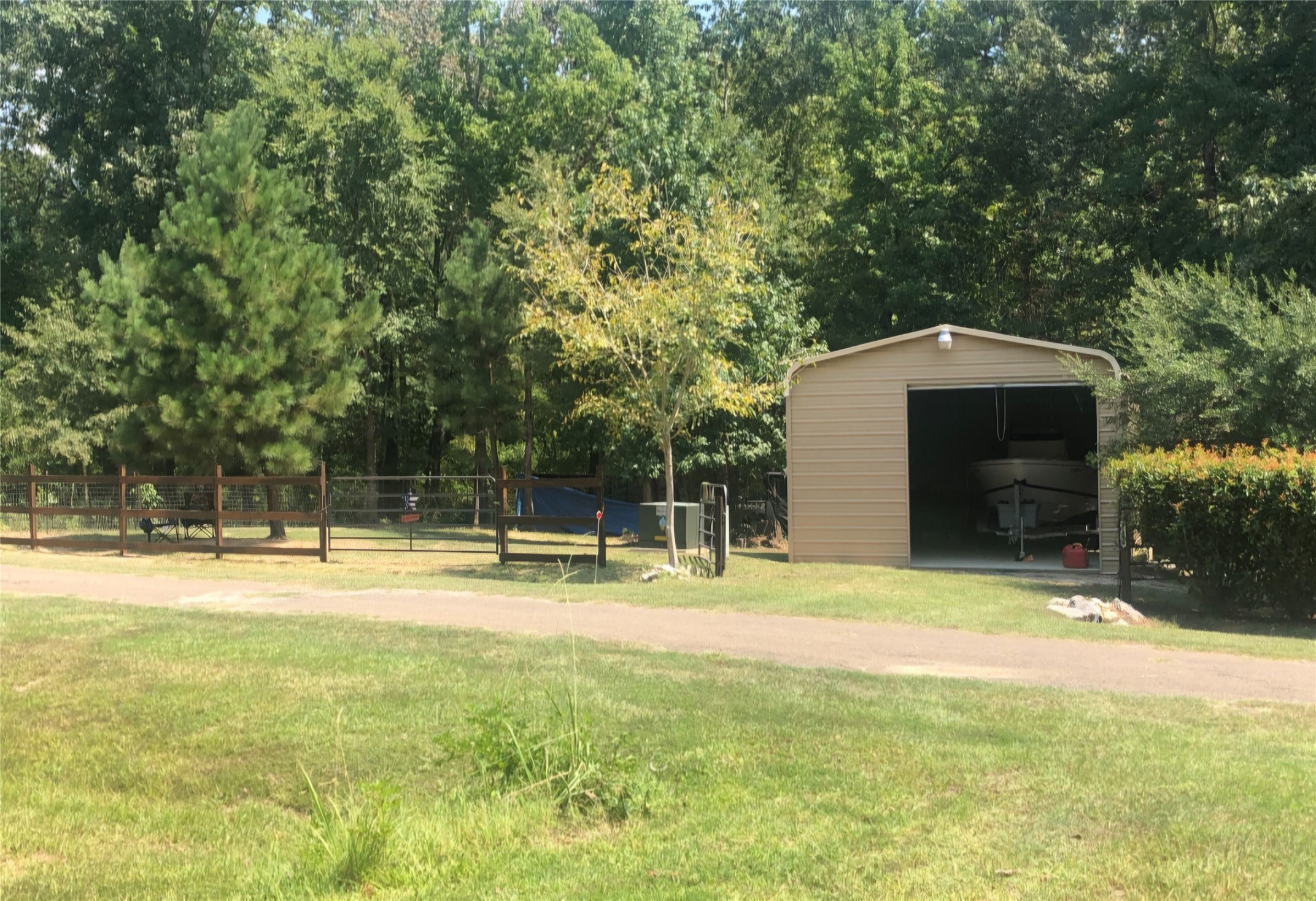 3 beautifully maintained lots with plenty of shade and space to build your dream home or turn the storage barn into your Barndominium.