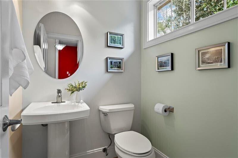 12 Rosalyn Road Georgetown, GA 39854 - Photo 17 of 82 a bathroom with a toilet sink and mirror