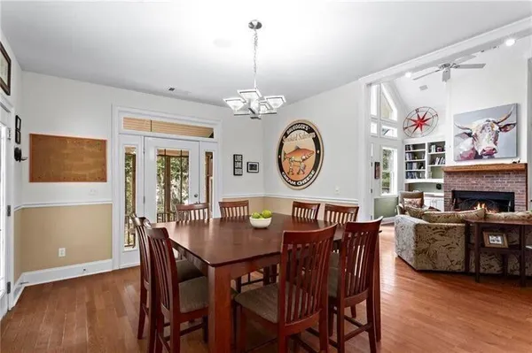 a bedroom with furniture and large windows