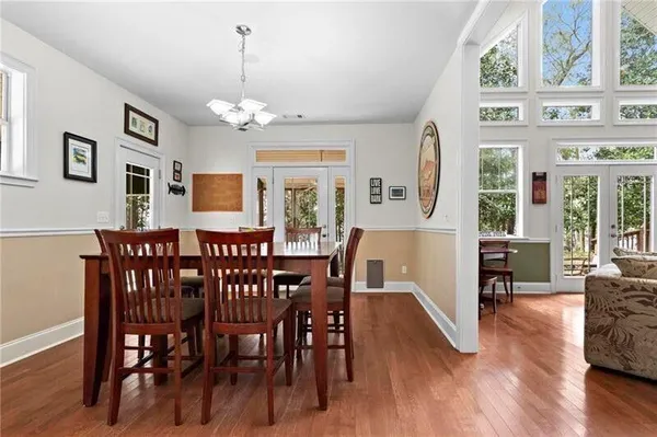 a view of a chairs and table on the wooden floor