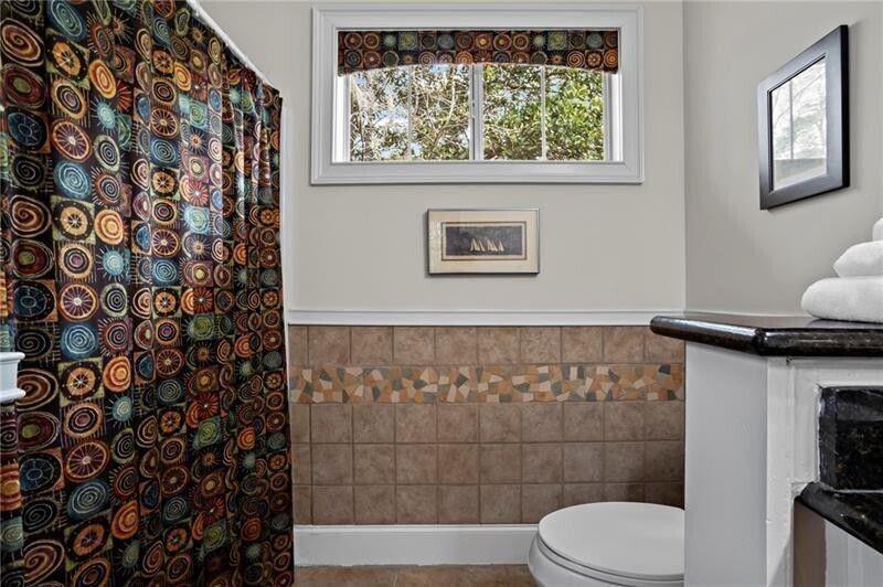 12 Rosalyn Road Georgetown, GA 39854 - Photo 28 of 82 a bathroom with a toilet and a shower curtain