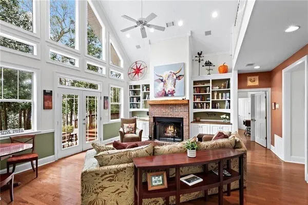a living room with furniture and a fireplace