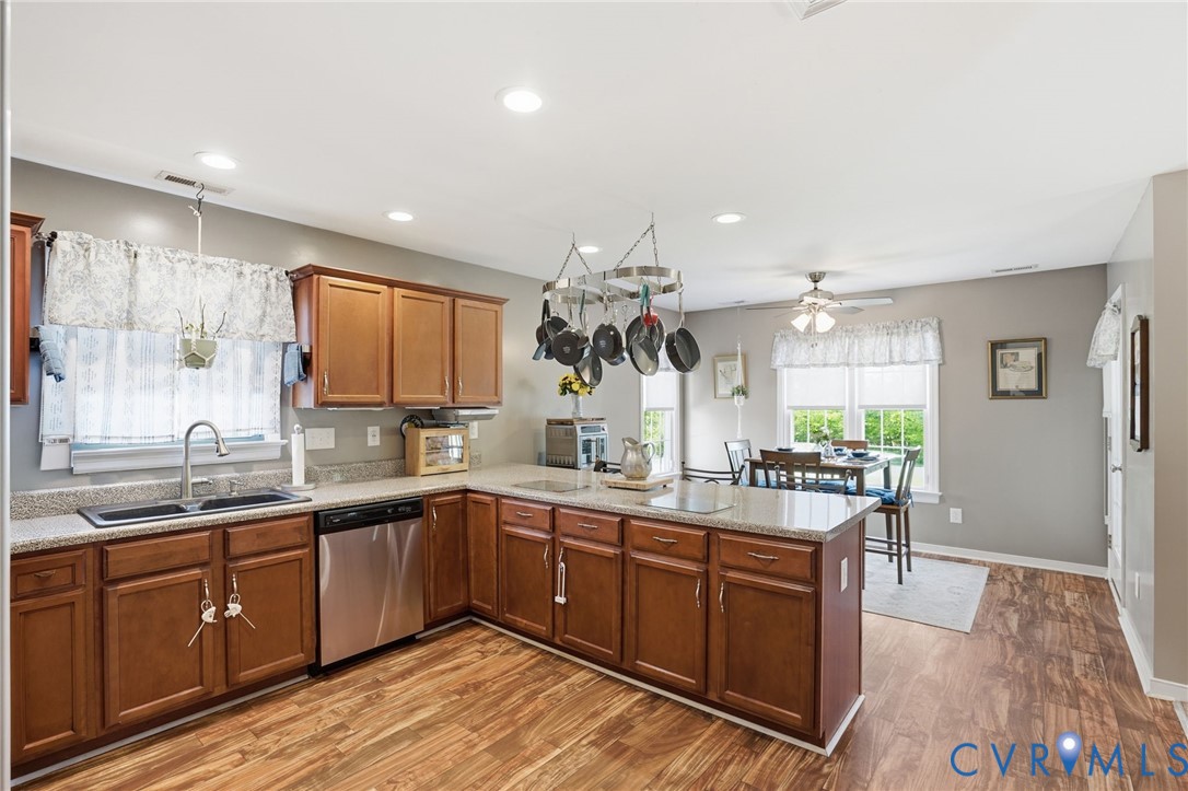 19012 Teman Road Beaverdam, VA 23015 - Photo 12 of 41 a large kitchen with kitchen island a sink stainless steel appliances and cabinets