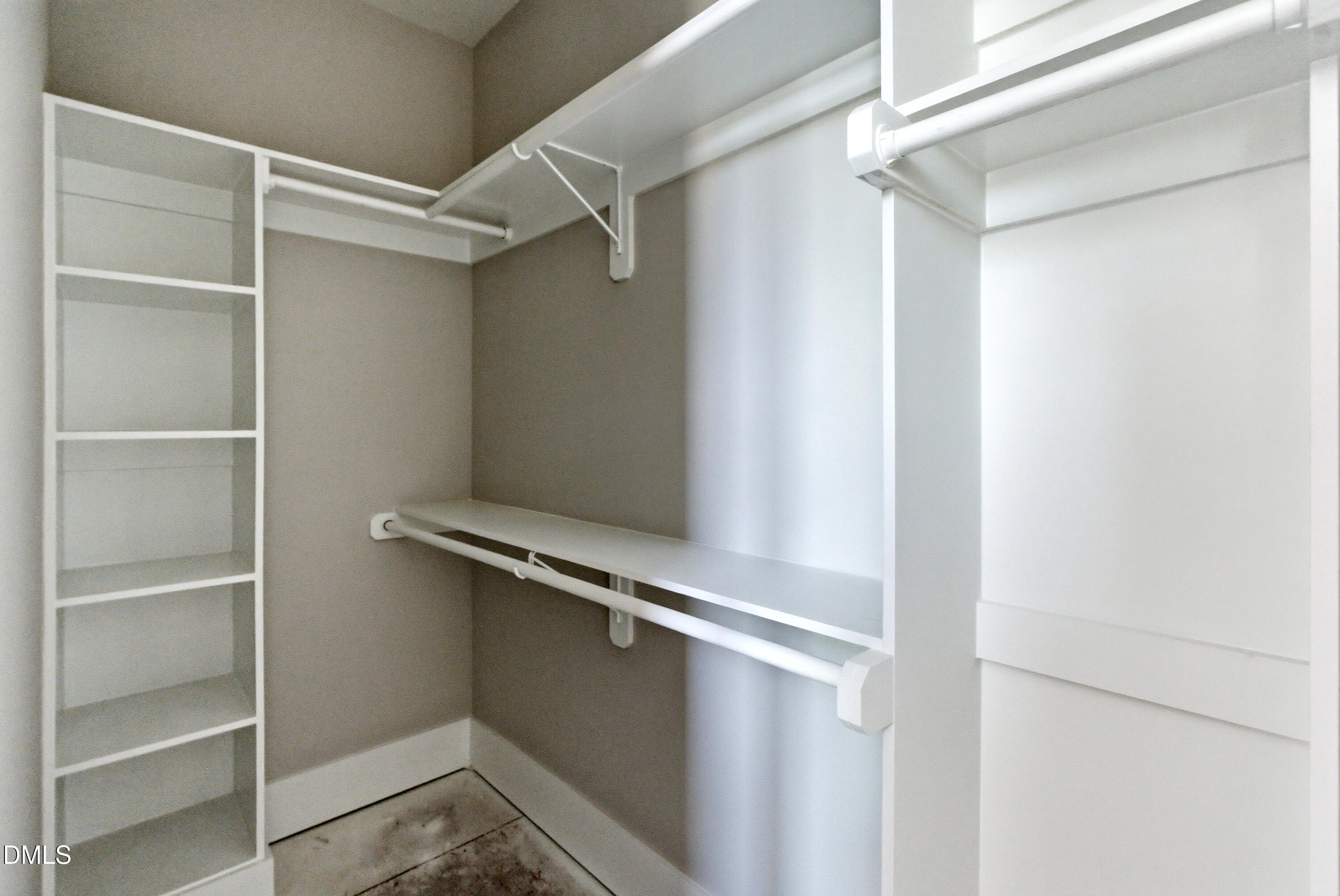 720 Noble Town Way, Unit 106 Raleigh, NC 27603 - Photo 14 of 28 a view of an empty walk in closet