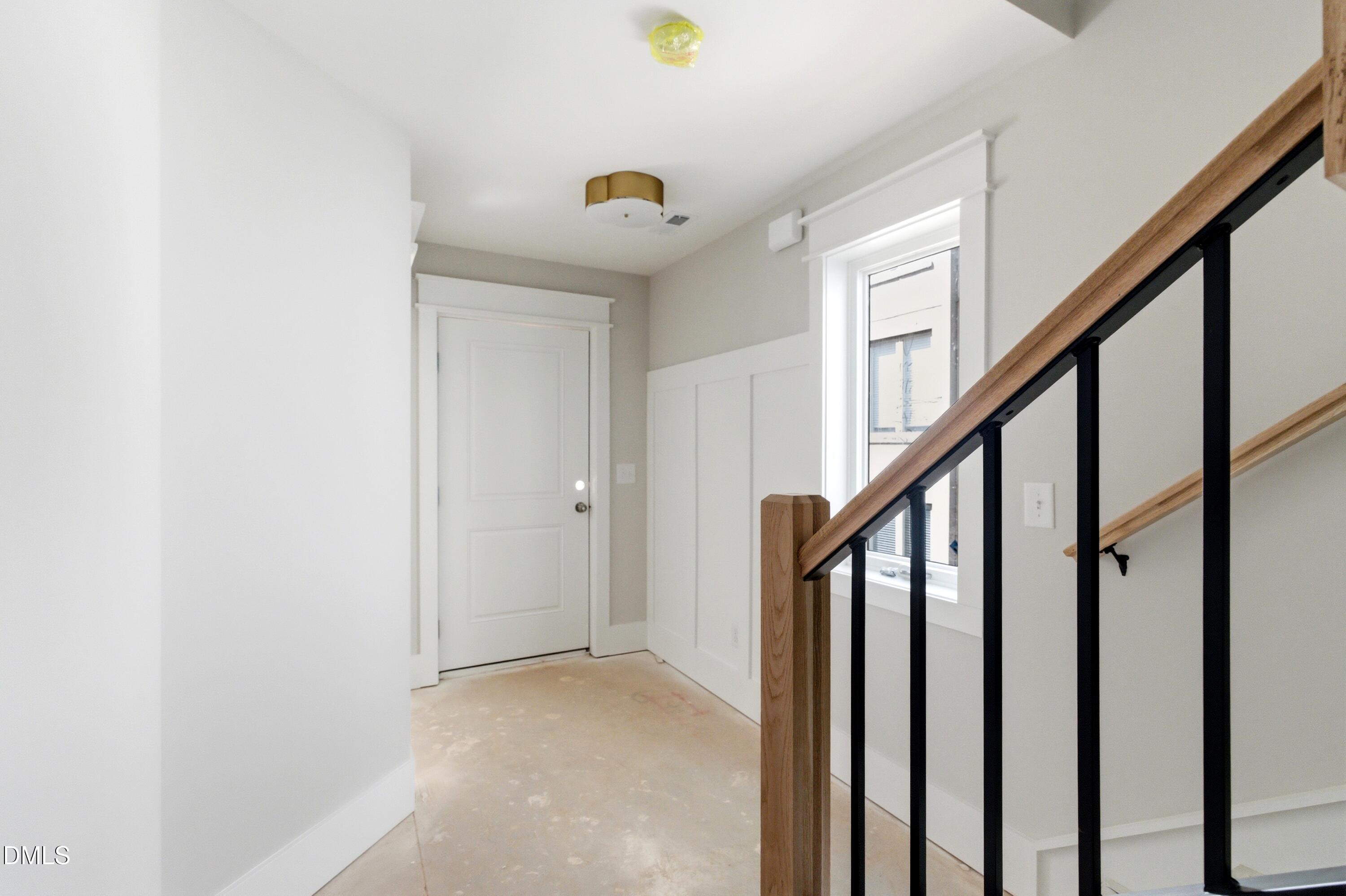 720 Noble Town Way, Unit 106 Raleigh, NC 27603 - Photo 22 of 28 a view of an entryway with wooden floor